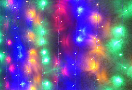 New year LED colorful lights on room wall with wallpaperの写真素材
