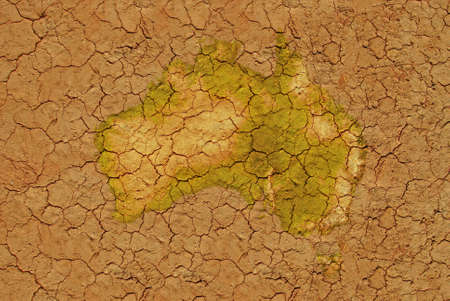 Image of dried soil with flat map of Australiaの写真素材