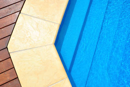 Swimming pool blue water detail in summer timeの写真素材
