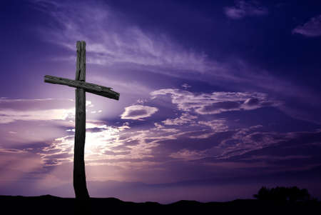 Silhouette of cross over purple sunrise or sunset Silhouette of cross over purple sunrise or sunset