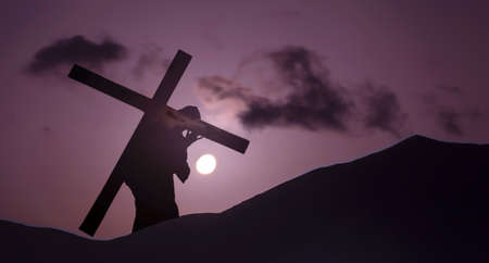 Christ carrying cross up Calvary on Good Friday over bright skyの写真素材