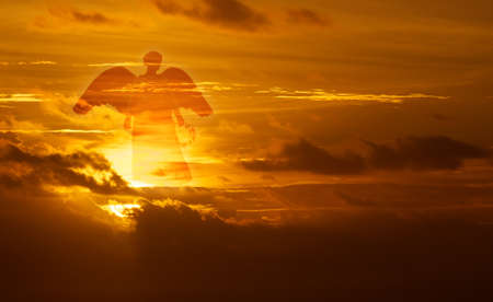 Beautiful angel in golden sky concept of religionの写真素材