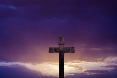 Christian cross at sunrise or sunset concept of religionの写真素材