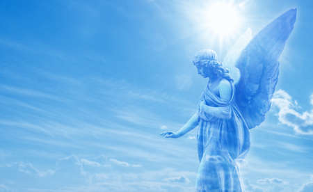 Beautiful angel in heaven with divine rays of sun lightの写真素材