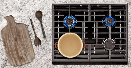 Kitchen tools and stove overlook shot on table background