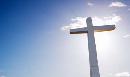 Christian cross over beautiful sky background concept of religion