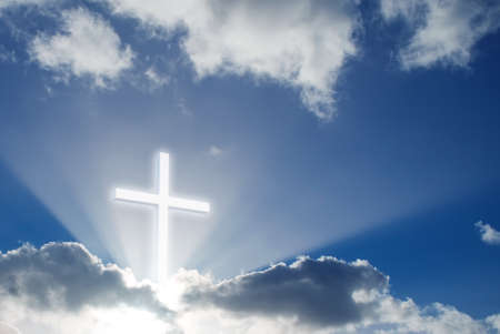 Christian cross made of wood over beautiful sky backgroundの写真素材
