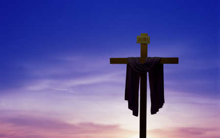 Christian cross at sunrise or sunset concept of religion