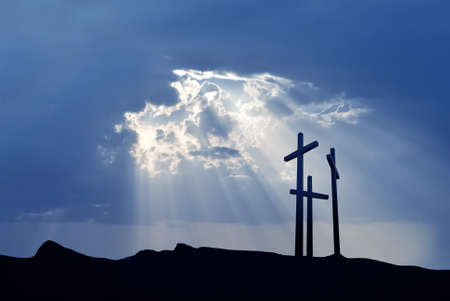 Three crosses on the mountain Golgotha representing the day of Christs crucifixion の写真素材