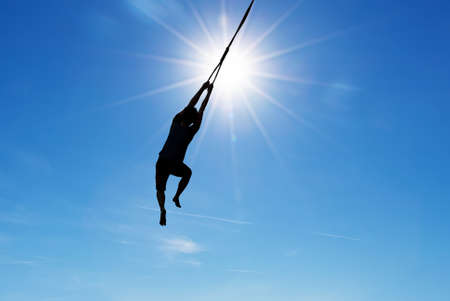 Silhouette of jumping person concept of success courage and motivation