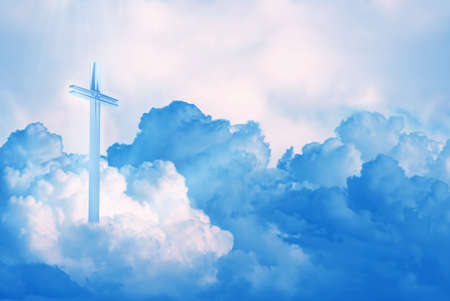 Abstract of Christ cross shining on puffy cloudsの写真素材