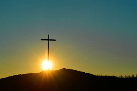 Christian cross at sunrise or sunset concept of religion with copy spaceの写真素材