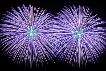 Colorful fireworks are on dark blue background. Concept of aesthetic and entertainment