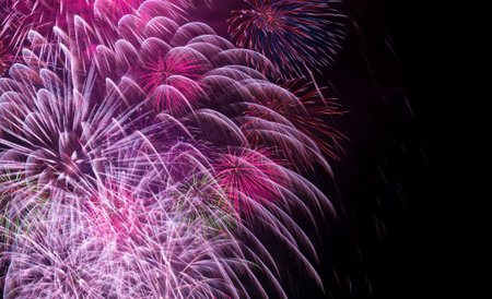 Colorful fireworks are on dark blue background. Concept of aesthetic and entertainmentの写真素材
