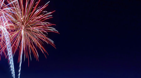 Magnificent display of fireworks illuminating a dark sky, image offers a generous space for text, making it suitable for various creative purposes such as advertising, event promotions, or festive designsの写真素材