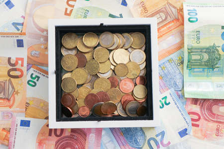 Money in euro currency euro banknotes and coins, loans, leasing. Save money, crisis and bankruptcyの写真素材