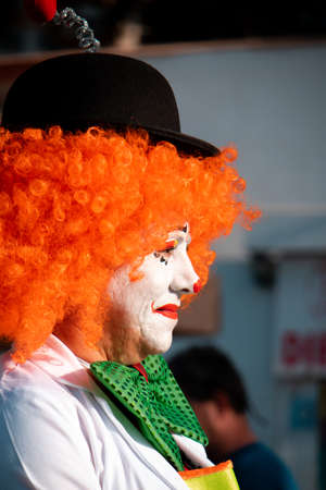 PUERTO DE LA CRUZ, SPAIN - FEBRUARY 29, 2020: The official end of the Carnival. Marching carnival groups, dancing, decorated cars and Carnival queens. Clown among other clownsのeditorial素材