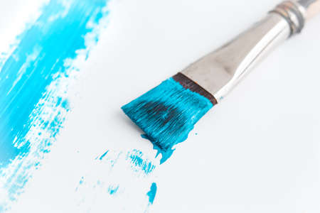 Brush that draws a blue line on a white backgroundの写真素材