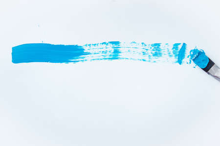 Brush that draws a blue line on a white backgroundの写真素材