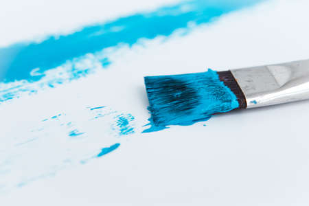 Brush that draws a blue line on a white backgroundの写真素材