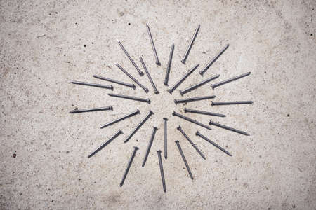 Hammer and nails on cement, textureの写真素材
