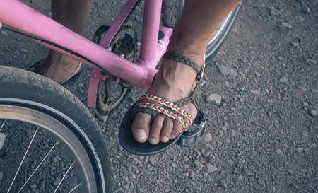 Foot on pedal of bicycle, active lifestyle.の写真素材