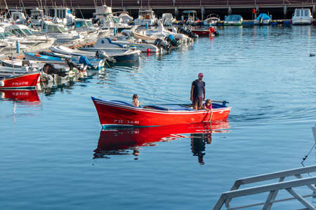 Port of boats and yachts with reflection in the water, San Sebastian, La Gomera, Spainの写真素材
