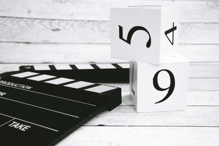Clapper board and cubes with numbersの写真素材