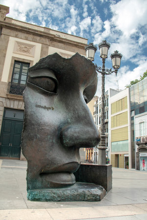 Monument in the town centre representing a theatre maskのeditorial素材