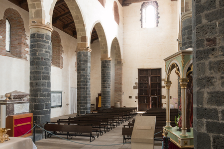 Ancient church in a castle with lava stoneのeditorial素材