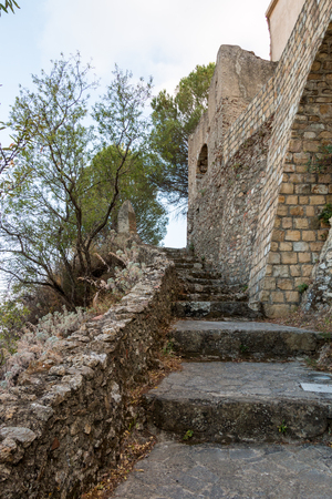 That ancient staircase leads to an isolated church on the hillの写真素材