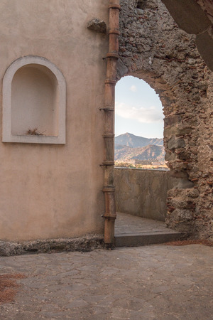 Ancient stone window That shows part of landscapeのeditorial素材