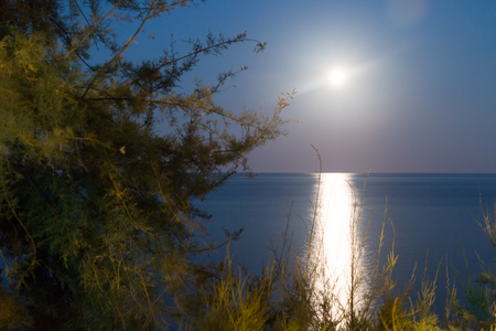 Full Moon in Torre Archirafi little village in east Sicilyの写真素材