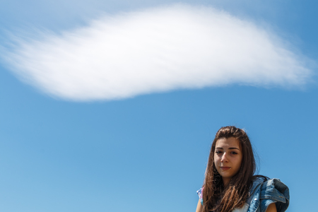 Girl with cloud on the head that thinksの写真素材