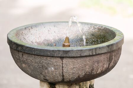 Concrete water fountain in the city parkの写真素材