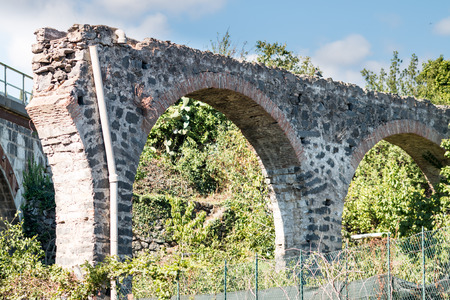 Ancient stone bridge collapsed after heavy stormの写真素材