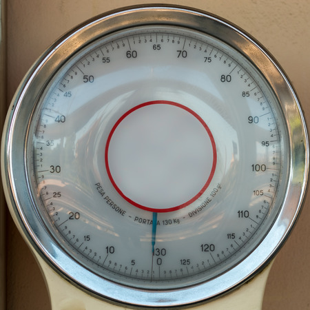 Coin operated weighing scale at train station