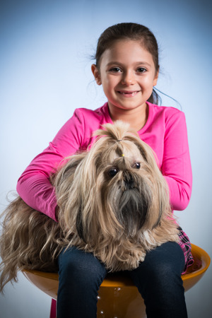 Girl posing with her dogの写真素材