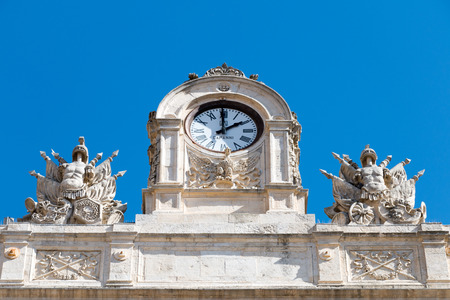 City antique clock with two statues on the sidesの写真素材