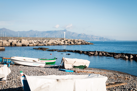 Port of Riposto with lighthouse and rocks protectionの写真素材