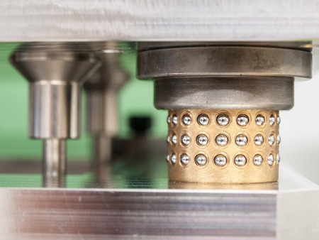 cylinder with spheres made by steel and brassの写真素材