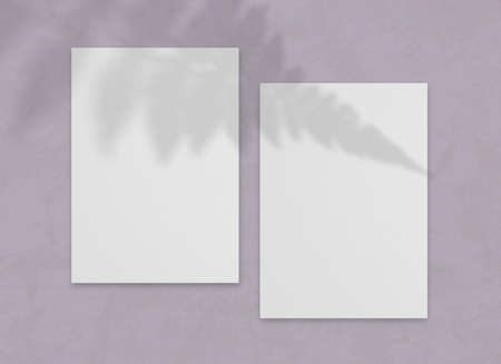 Blank vertical paper sheet with leaves shadow overlay. For wedding invitation or postcard mock up.