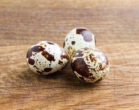 Quail eggs on wooden deskの写真素材