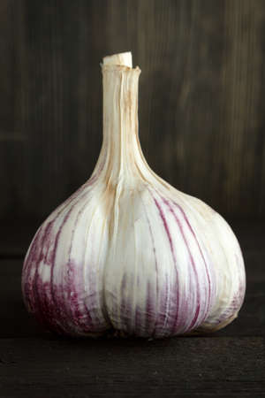 Garlic on woodの写真素材