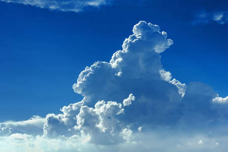 Blue sky with cumulus clouds as a background