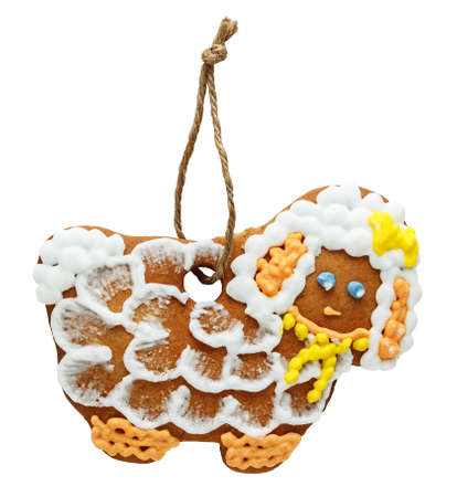 Gingerbread in the shape of a sheep isolated on whiteの写真素材