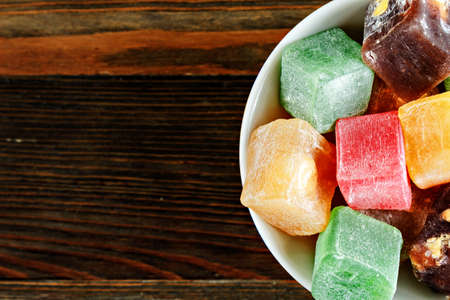 Turkish delight on wooden board with copyspaceの写真素材
