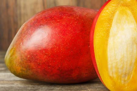 Close-up of mango on wood backgroundの写真素材