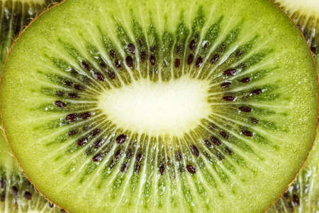 Slices of kiwi as a backgroundの写真素材
