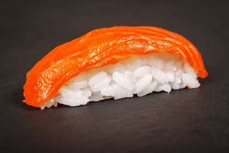 Nigiri sush with salmoni on a slate plate closeupの写真素材